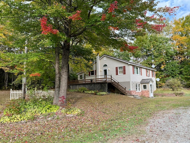 view of front of house with a wooden deck