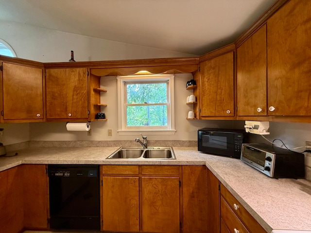 kitchen with black appliances, lofted ceiling, and sink