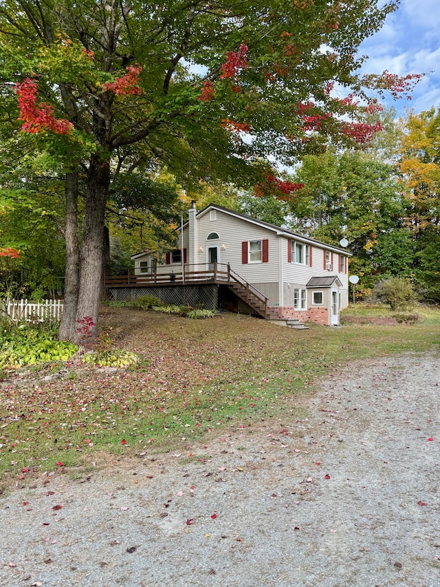 manufactured / mobile home with a wooden deck