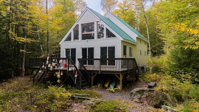 5-27 Cooks Is, Orneville Twp, ME 04463 - rear view of house featuring stairs, a deck, metal roof, and a view of trees
