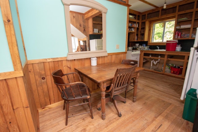 5-27 Cooks Is, Orneville Twp, ME 04463 - dining room with wainscoting, wood walls, and wood finished floors