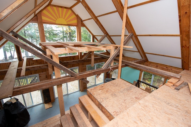 staircase featuring lofted ceiling and plenty of natural light