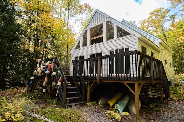 back of house featuring a deck