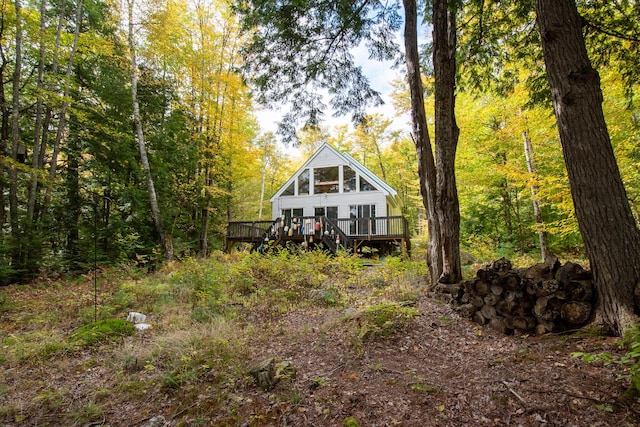 5-27 Cooks Is, Orneville Twp, ME 04463 - back of property with a wooden deck and a forest view