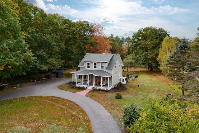 459 Durham Rd, Brunswick, ME 04011 - view of front of property with a porch, driveway, a shingled roof, central AC unit, and a front lawn