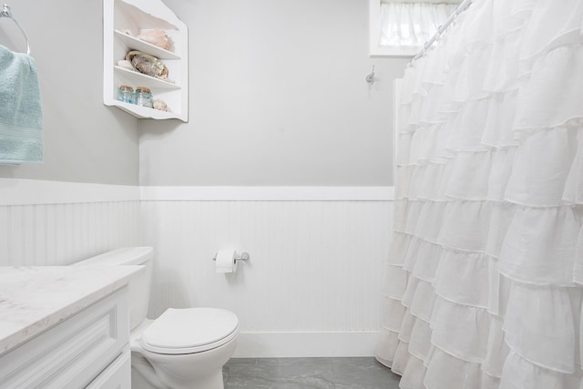 459 Durham Rd, Brunswick, ME 04011 - full bathroom featuring wainscoting, vanity, toilet, marble finish flooring, and a shower with curtain