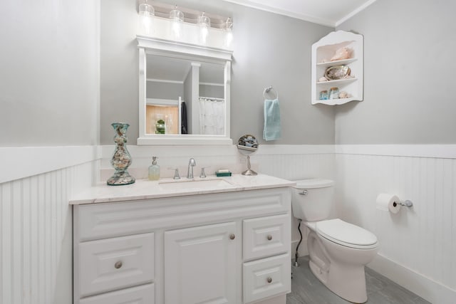 459 Durham Rd, Brunswick, ME 04011 - full bathroom featuring a wainscoted wall, toilet, vanity, and ornamental molding