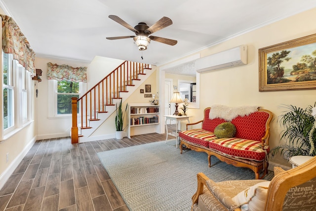 459 Durham Rd, Brunswick, ME 04011 - sitting room with a wall mounted air conditioner, stairway, ceiling fan, dark wood-style flooring, and baseboards