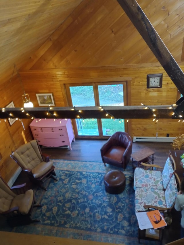living area featuring a baseboard radiator, wood finished floors, wood walls, and vaulted ceiling with beams