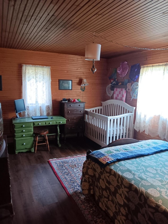 bedroom featuring dark hardwood / wood-style floors, wooden ceiling, and wooden walls