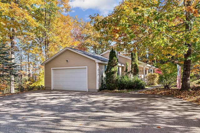 view of side of property featuring a garage