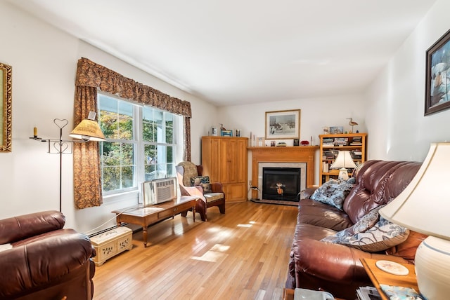 living room featuring cooling unit and hardwood / wood-style flooring