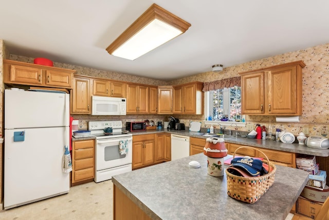 kitchen with white appliances and sink