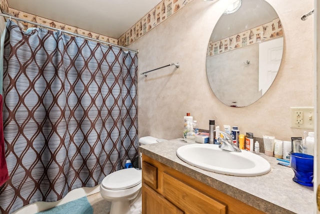 bathroom with vanity, toilet, tile patterned floors, and curtained shower