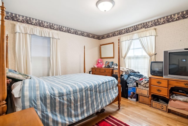 bedroom with wood-type flooring