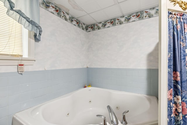 bathroom featuring a tub to relax in