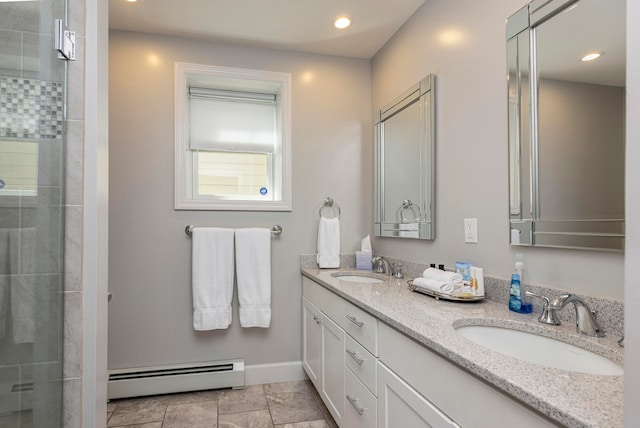 bathroom featuring vanity, a baseboard radiator, and a shower with door