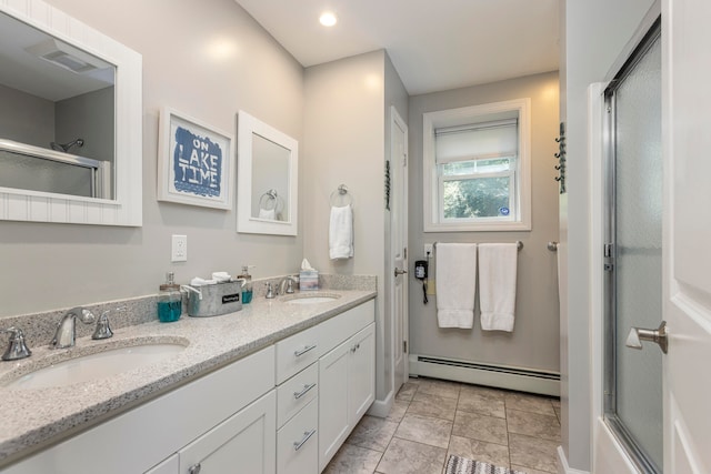 bathroom featuring vanity, walk in shower, and a baseboard heating unit