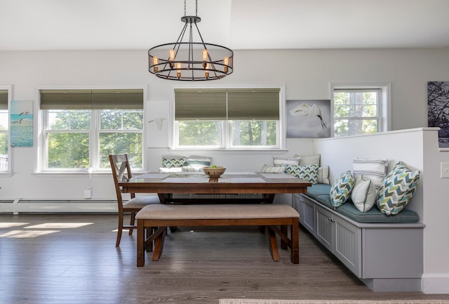 dining space featuring breakfast area, a notable chandelier, a baseboard radiator, and dark hardwood / wood-style flooring