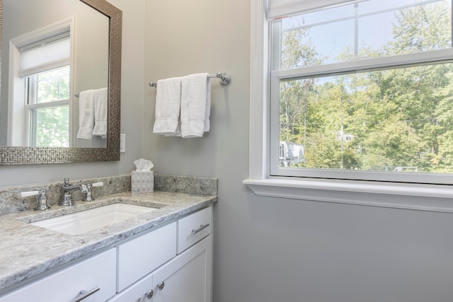 bathroom featuring vanity and plenty of natural light