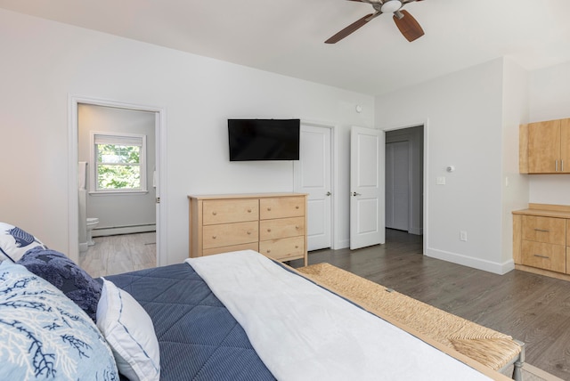 bedroom with ensuite bathroom, ceiling fan, a baseboard radiator, and dark hardwood / wood-style flooring