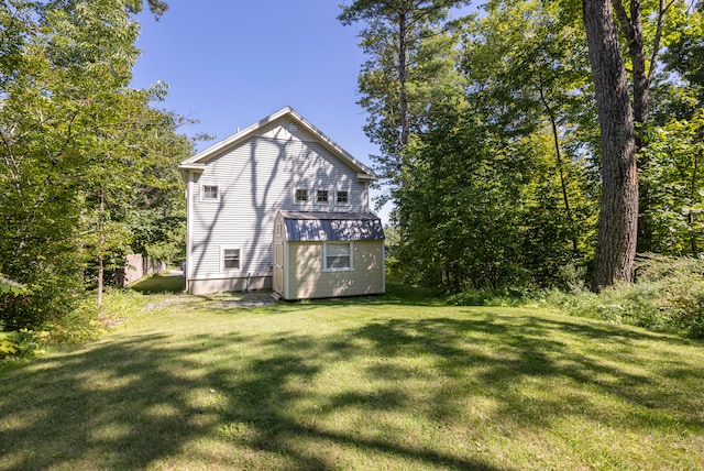 back of house with a yard