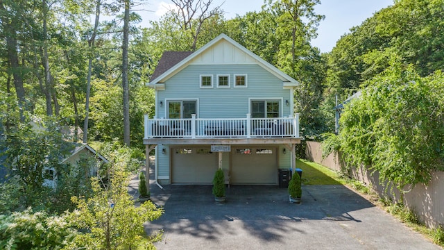 back of house with a garage