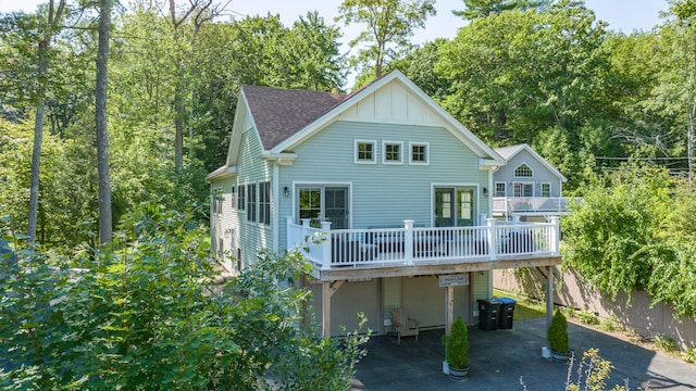 back of house featuring a deck