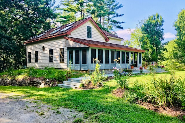 back of house with a yard