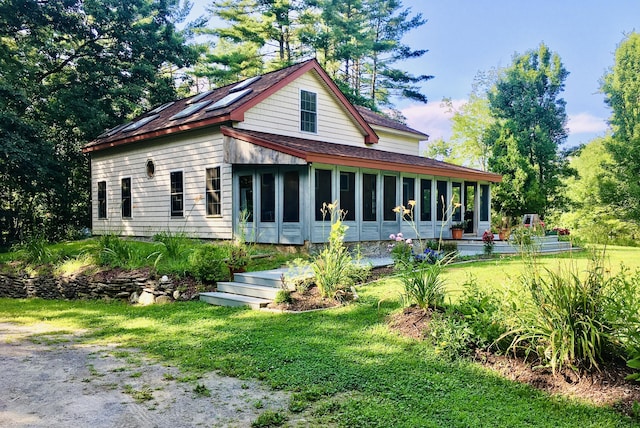 552 Egypt Rd, Alna, ME 04535 - rear view of property featuring a shingled roof, a sunroom, and a lawn