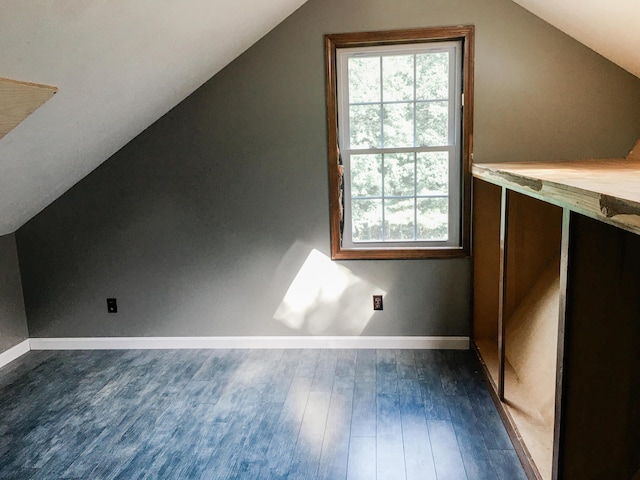 552 Egypt Rd, Alna, ME 04535 - additional living space with dark wood-type flooring, baseboards, and vaulted ceiling