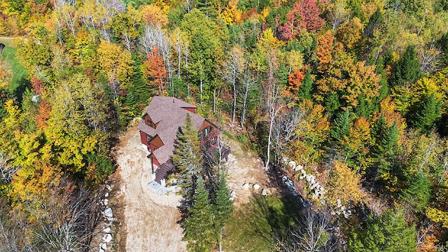 bird's eye view featuring a wooded view