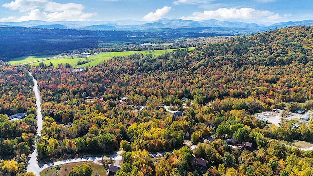 aerial view featuring a mountain view and a view of trees