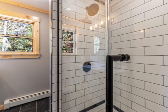 bathroom featuring baseboard heating and walk in shower