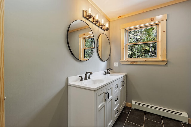 bathroom featuring tile patterned flooring, vanity, and a baseboard heating unit