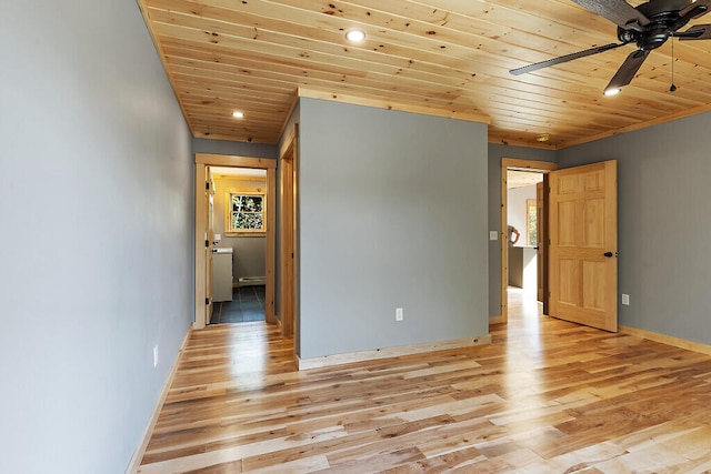 spare room with ceiling fan, wooden ceiling, recessed lighting, baseboards, and light wood-style floors