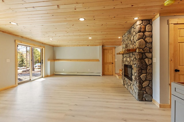 unfurnished living room featuring light wood-style flooring, a baseboard radiator, wood ceiling, and a stone fireplace