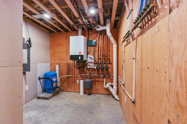 utility room featuring electric panel and tankless water heater