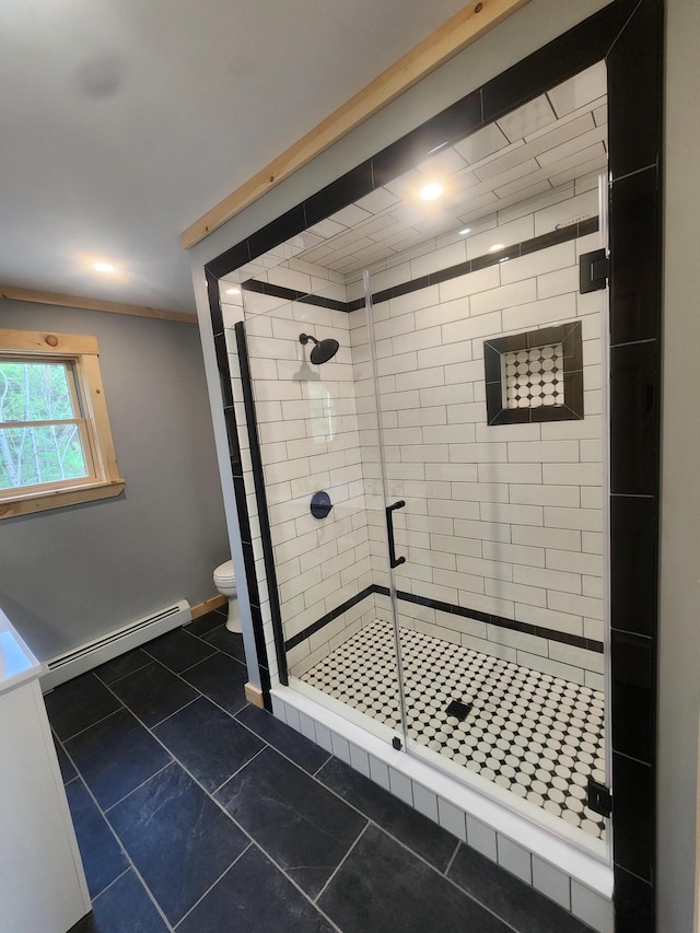 bathroom with walk in shower, a baseboard heating unit, tile patterned floors, toilet, and ornamental molding