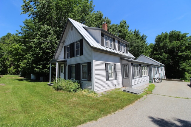 view of side of home featuring a yard