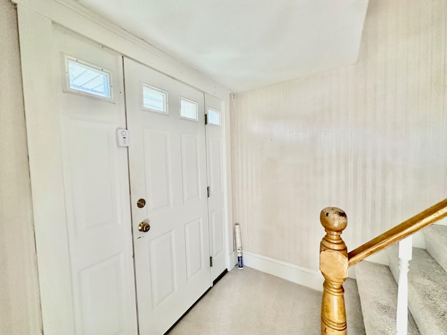 view of carpeted foyer