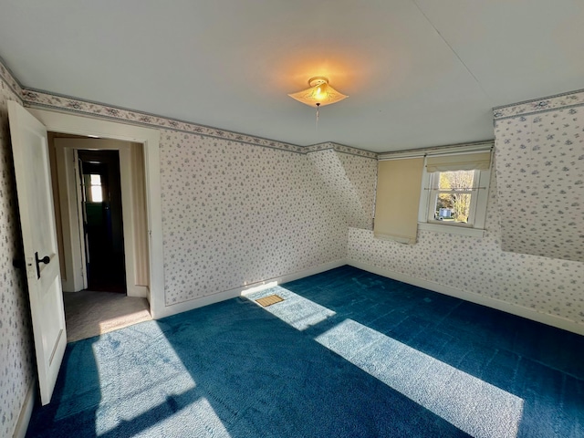 unfurnished room featuring carpet floors