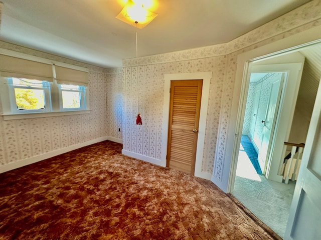 unfurnished bedroom featuring carpet