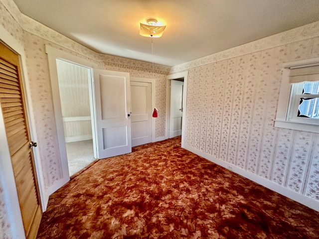 unfurnished bedroom featuring carpet flooring