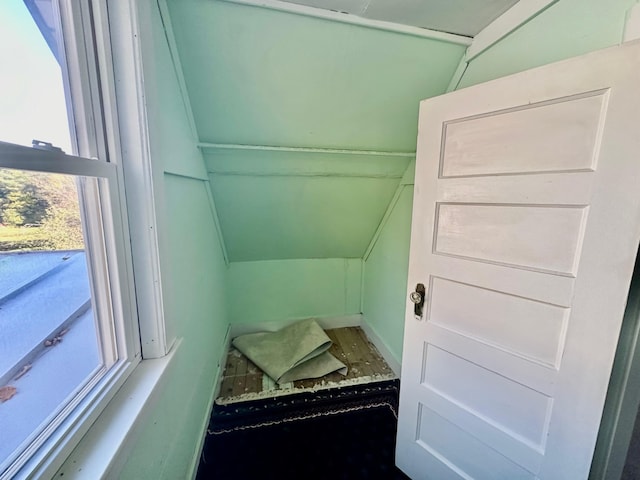 bathroom featuring lofted ceiling