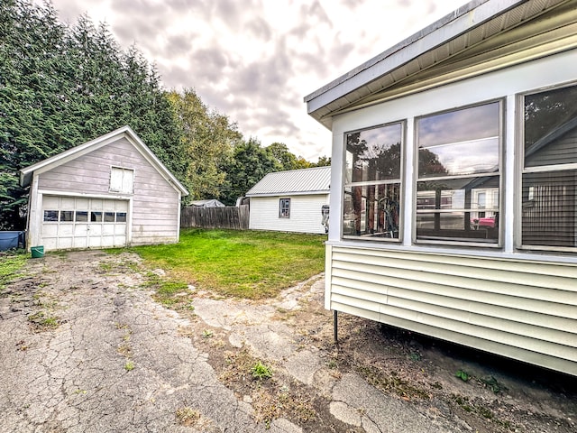 view of yard with an outbuilding and a garage