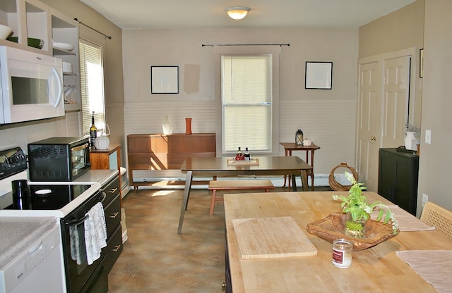 dining area with concrete floors