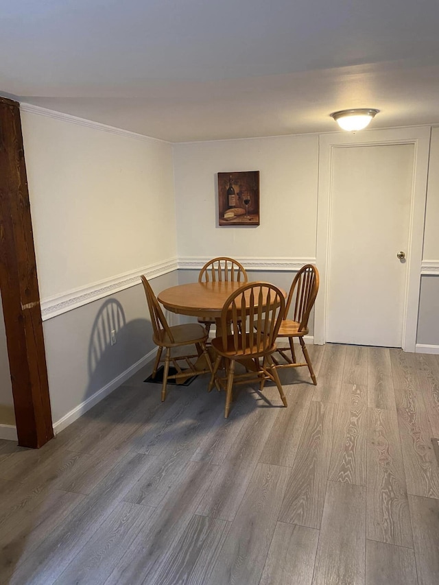 dining area with wood-type flooring