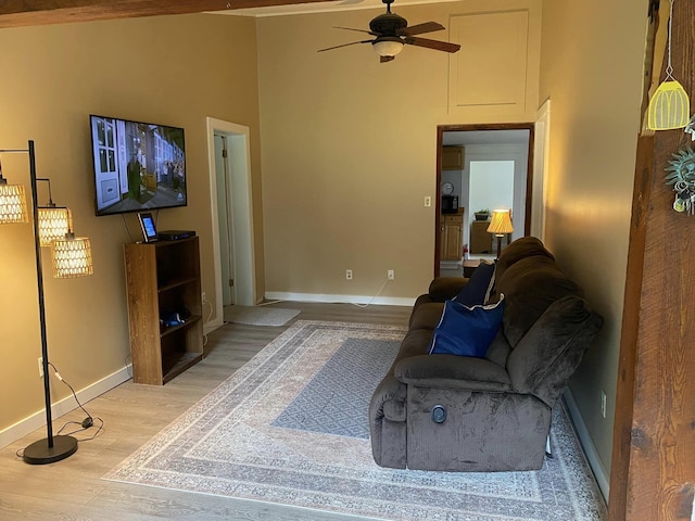 living room with hardwood / wood-style floors and ceiling fan