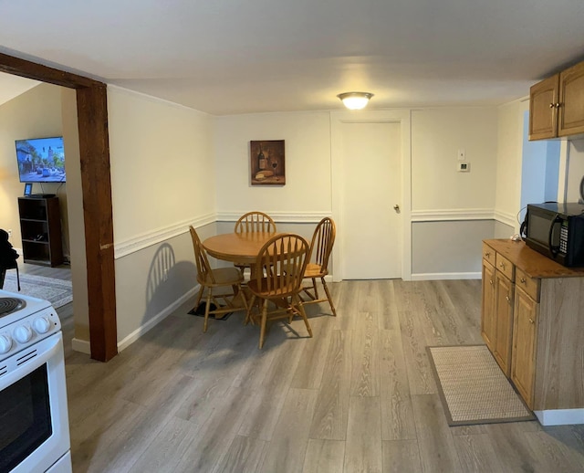 dining area with light hardwood / wood-style floors